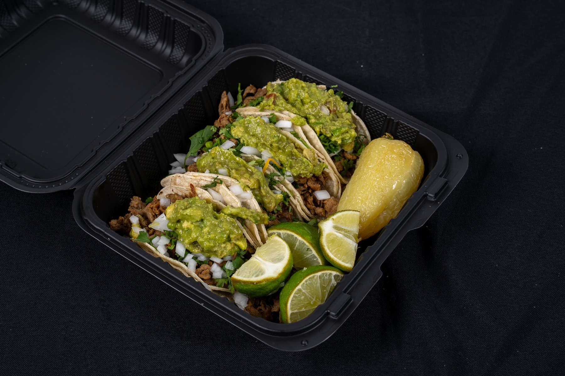 Tacos prepared with fresh meat and toppings from Asaderos